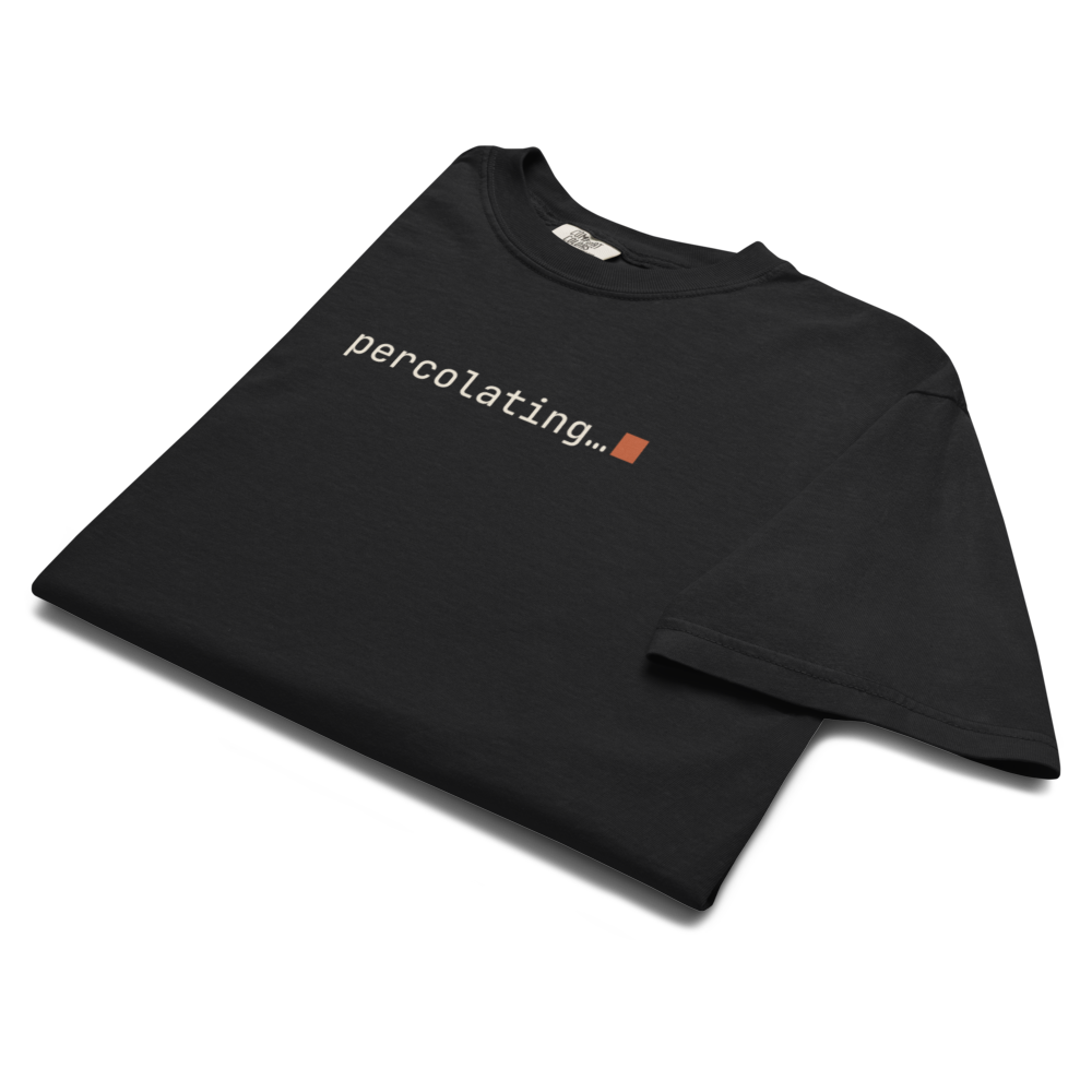 Vol. 02 percolating… tee, black, folded with the print showing